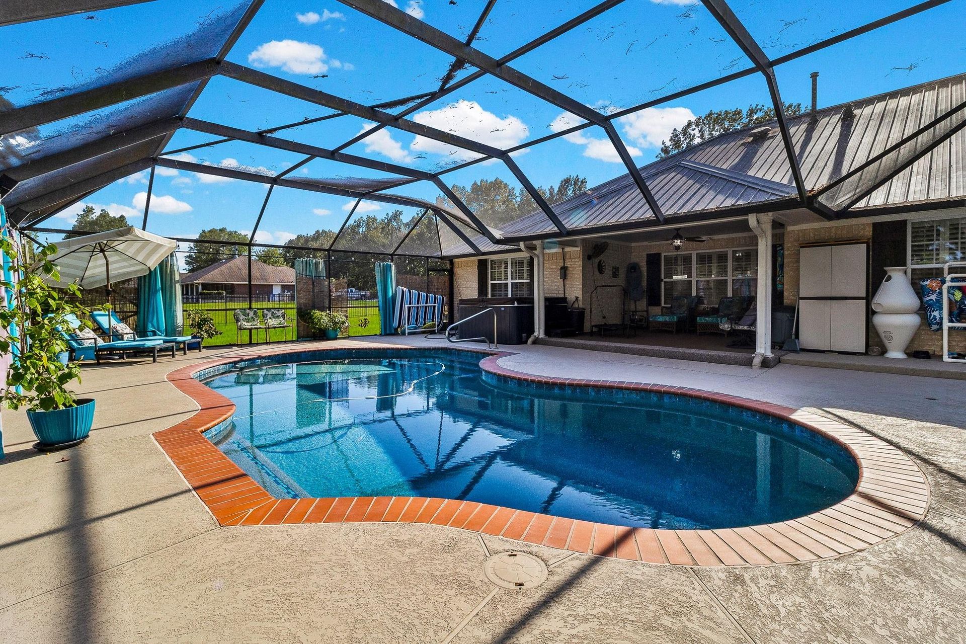 Screened pool by day