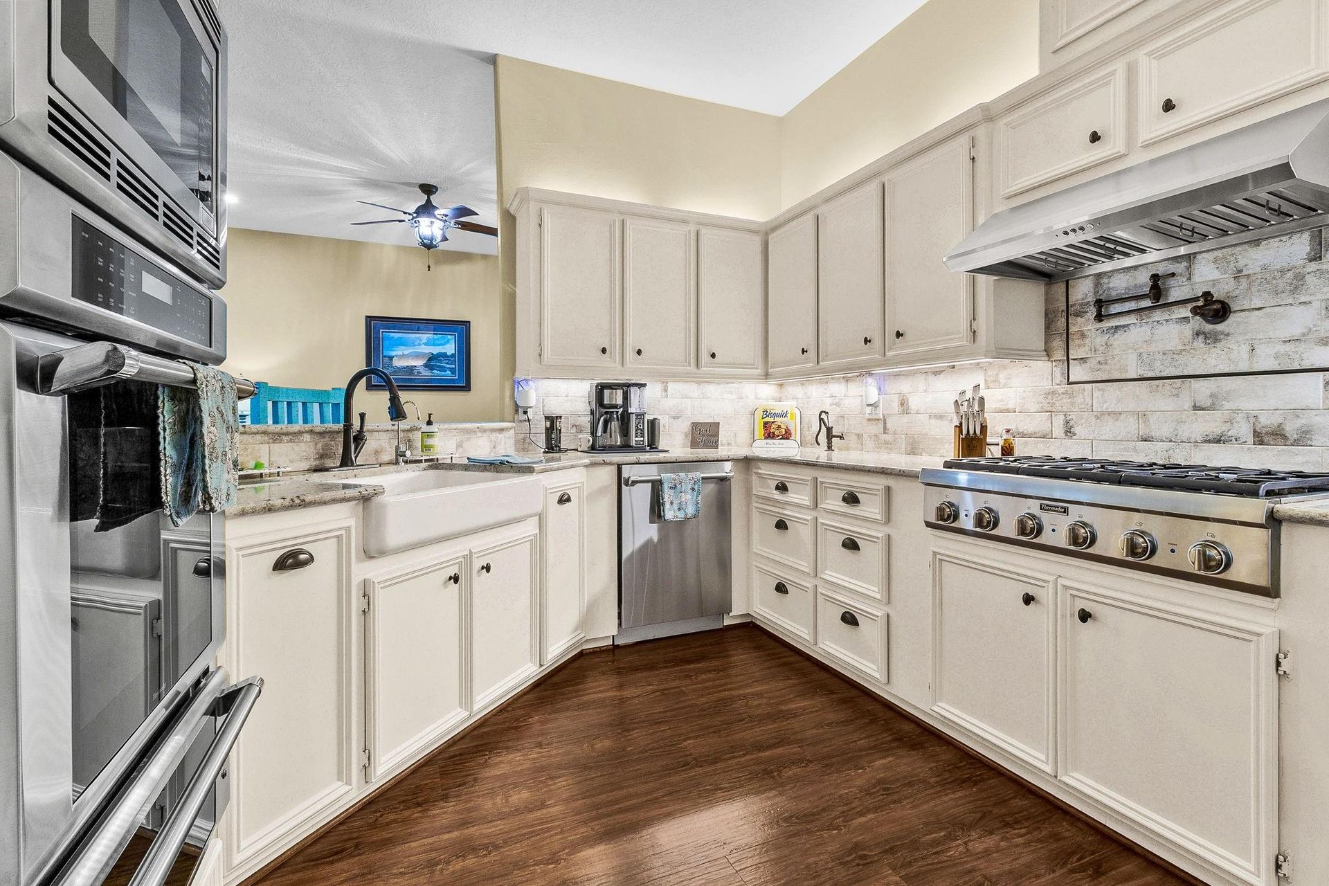 Kitchen with white cabinets and gas cooktop